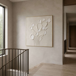 Textured white floral painting viewed from a warm gray stair landing.
