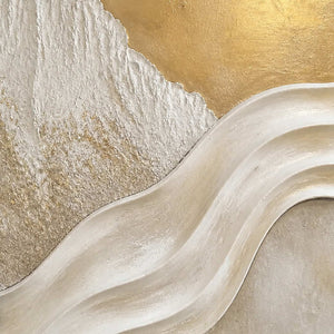 Close-up of sculpted ivory waves and luminous hand-painted gold texture.
