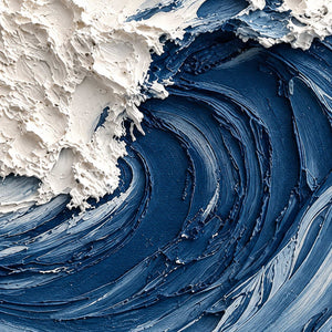 Close-up of deep blue curved wave ridges beneath rough, raised white foam.
