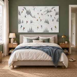 Winter at Play in a white frame above a neutral bed against a muted green bedroom wall.