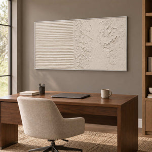 Wordless Dialogue in a silver frame above a wood desk and cream swivel chair against a warm neutral office wall.