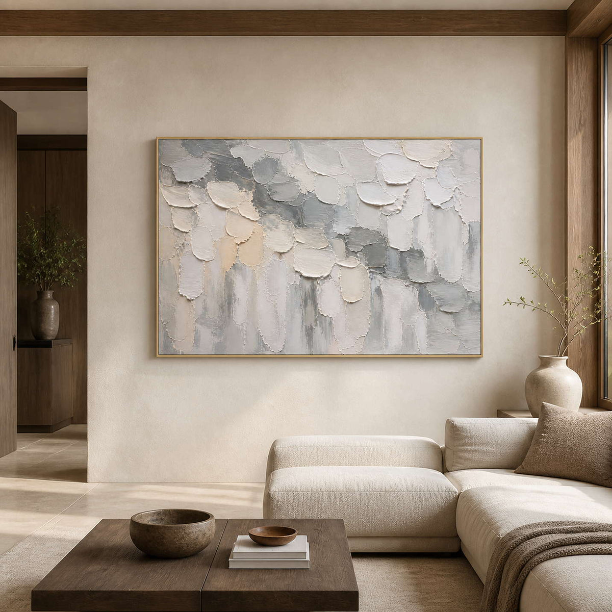 Textured neutral abstract wall art in a warm stone living room.