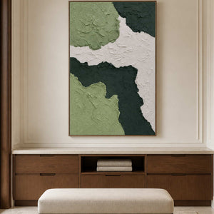 Wood framed green textured artwork above a linen cabinet and upholstered bench.