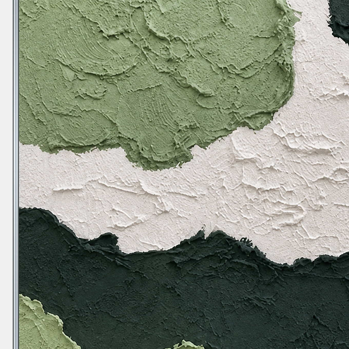 Close detail of raised sage green and white paint with rough curved edges.