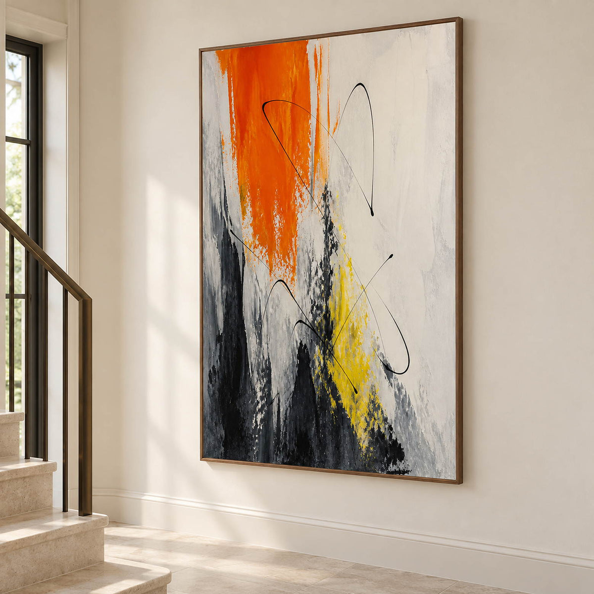 Vertical abstract artwork in orange, black, white, charcoal, and yellow, displayed beside a staircase in a brown wood frame.