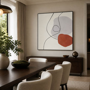 Gray-and-terracotta abstract artwork above a dining room sideboard.
