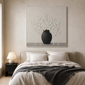 Textured white floral wall art displayed in a soft wabi sabi bedroom.