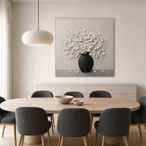 Textured white floral wall art displayed in a Nordic dining room.
