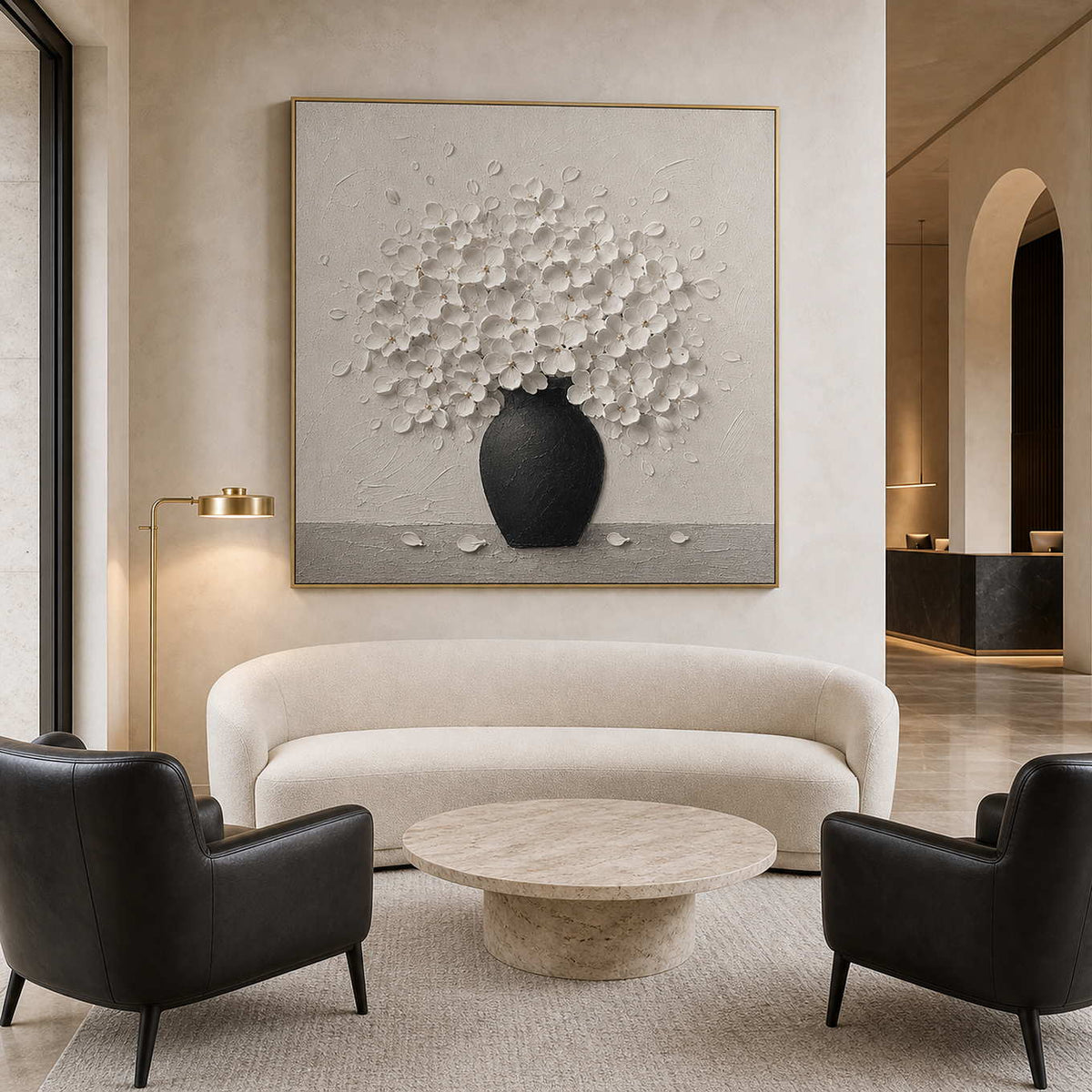 Textured white floral wall art displayed in a boutique hotel lounge.