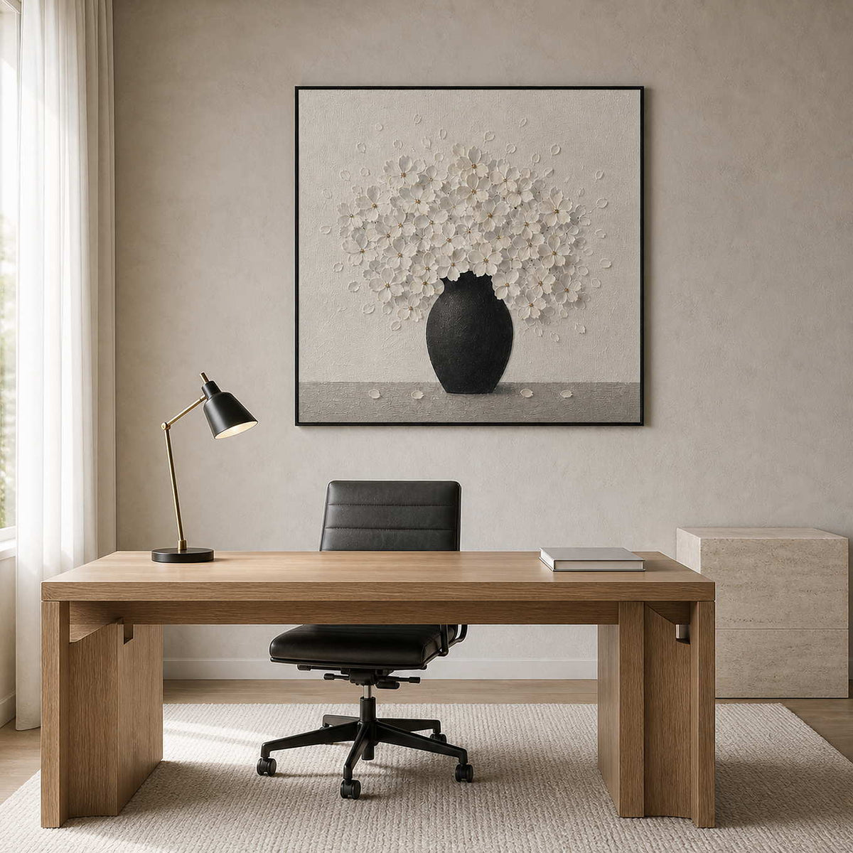 Textured white floral wall art displayed in a monochrome home office.