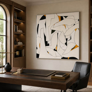 Geometric wall art behind a wooden desk and black chair.