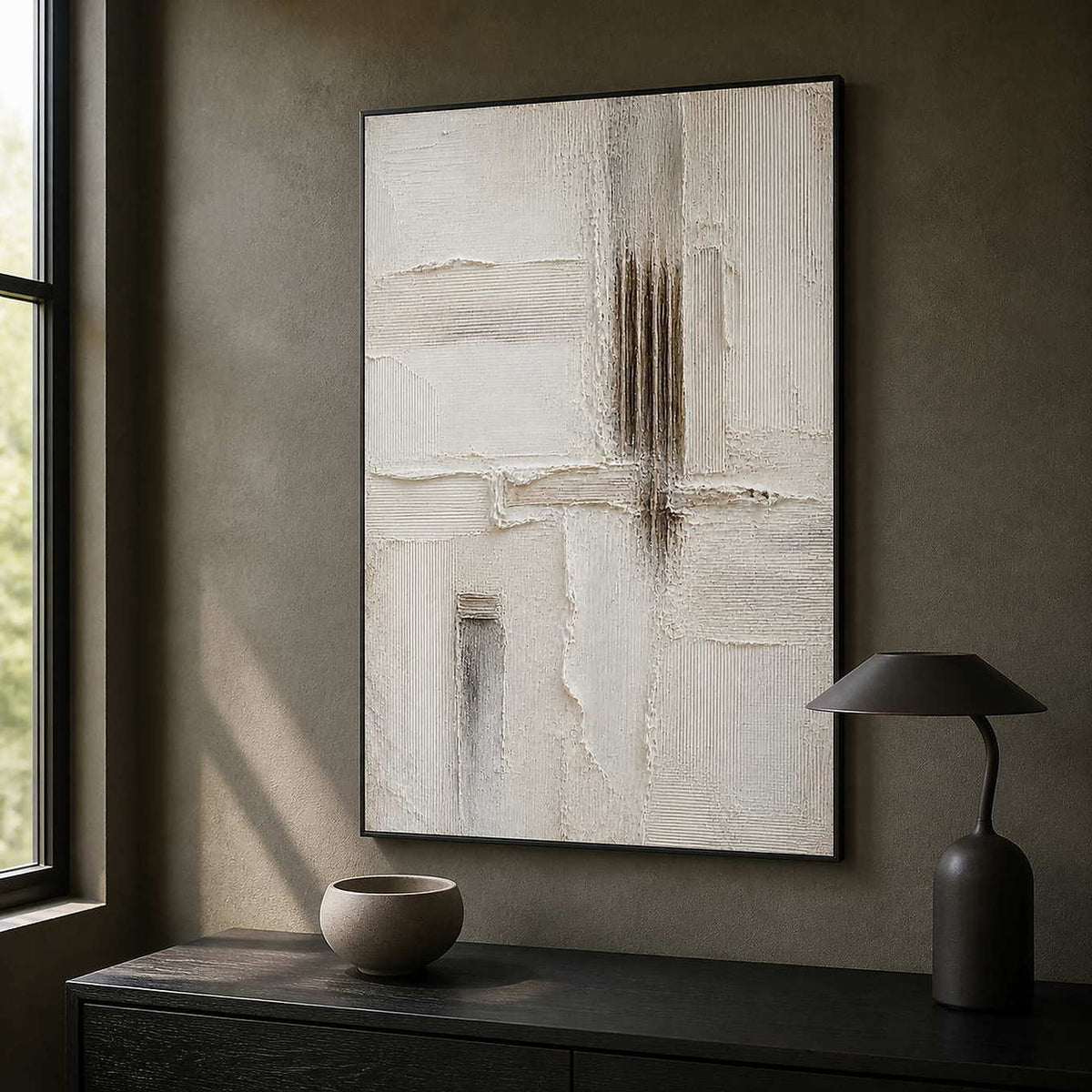 Vertical ivory abstract artwork bringing focus to a dark office.