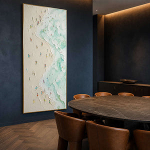 Mint and ivory coastal painting displayed in a navy dining room.