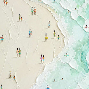 Close-up of raised ivory sand, mint surf, and tiny painted figures.