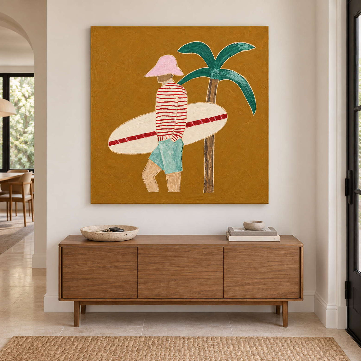 Warm ochre figurative painting above a wood entry cabinet beside a dark-framed doorway.