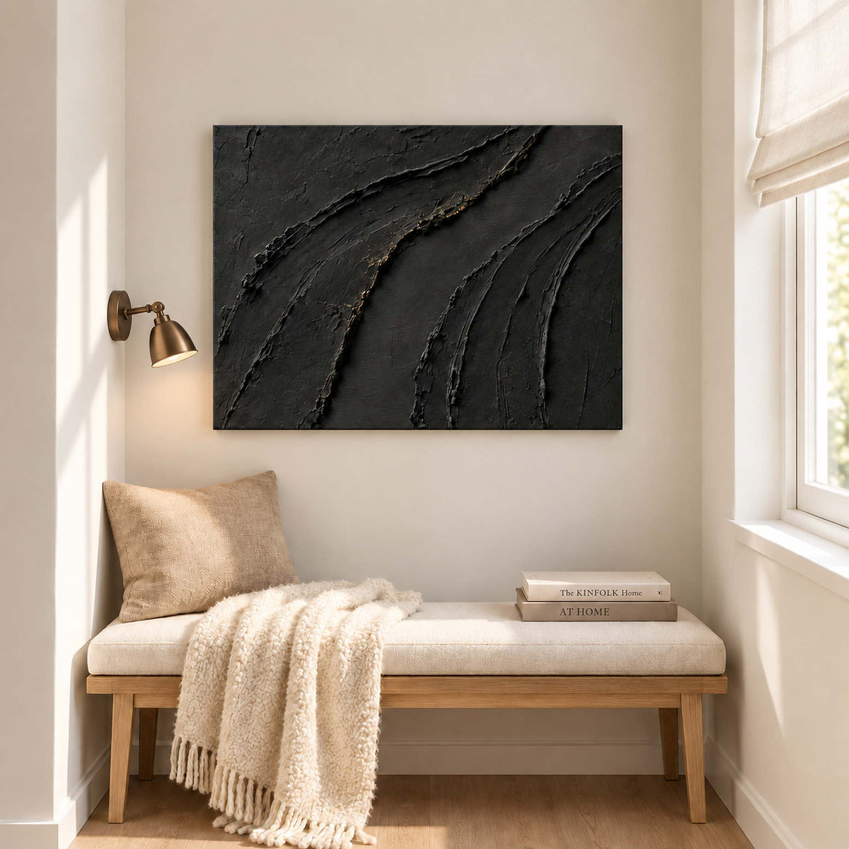 Sweeping raised black ridges with subtle gold accents without an outer frame, displayed beside seating in a lounge.