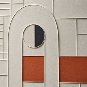 Close-up of raised ivory grid, arch, charcoal circle, and terracotta blocks.