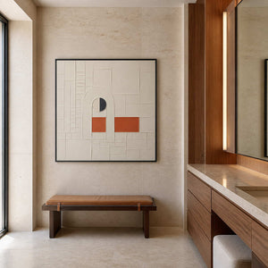 Ivory and terracotta relief displayed in a refined travertine bathroom.