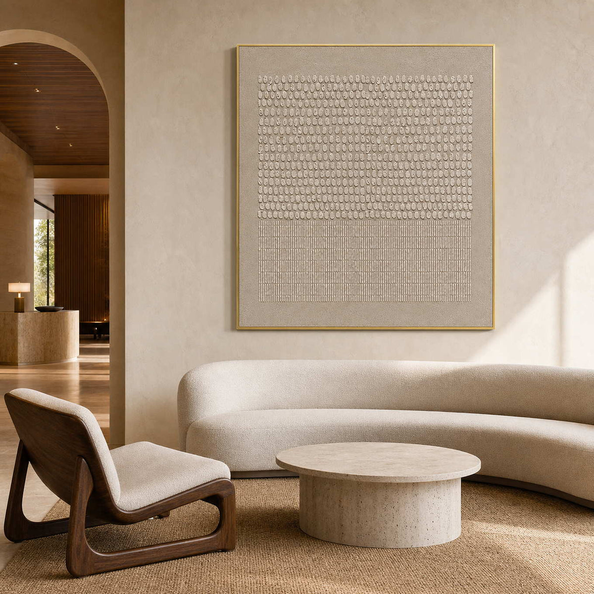 Warm neutral textured wall art displayed in a quiet design hotel lobby.