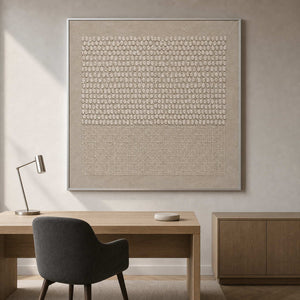Minimalist relief artwork displayed in a light oak consultation office.