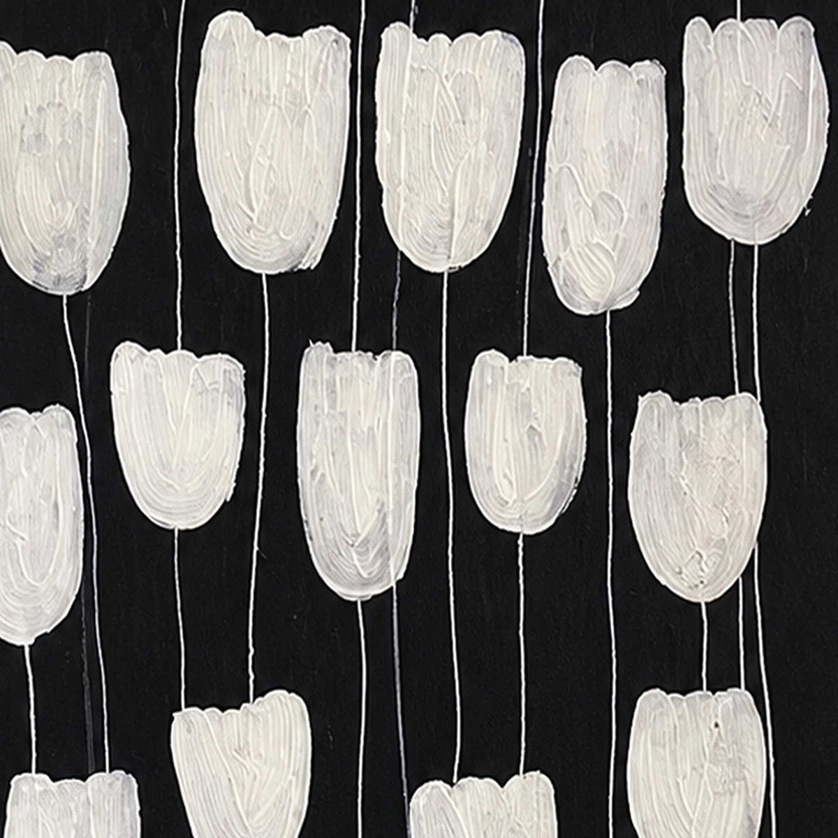 Close view of ridged white flower petals and slender stems against black.