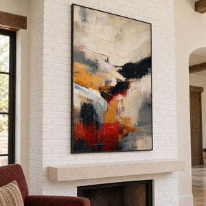 Ivory, ochre and red abstract strokes crossed by bold black bands in a black frame, displayed above a fireplace.