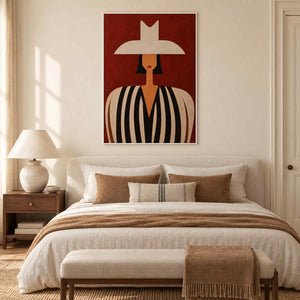 Modern portrait wall art displayed in a bedroom with a white metal frame
