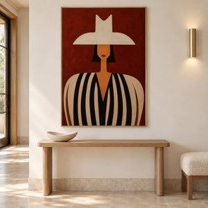 Modern portrait wall art in an entryway with a gold metal frame
