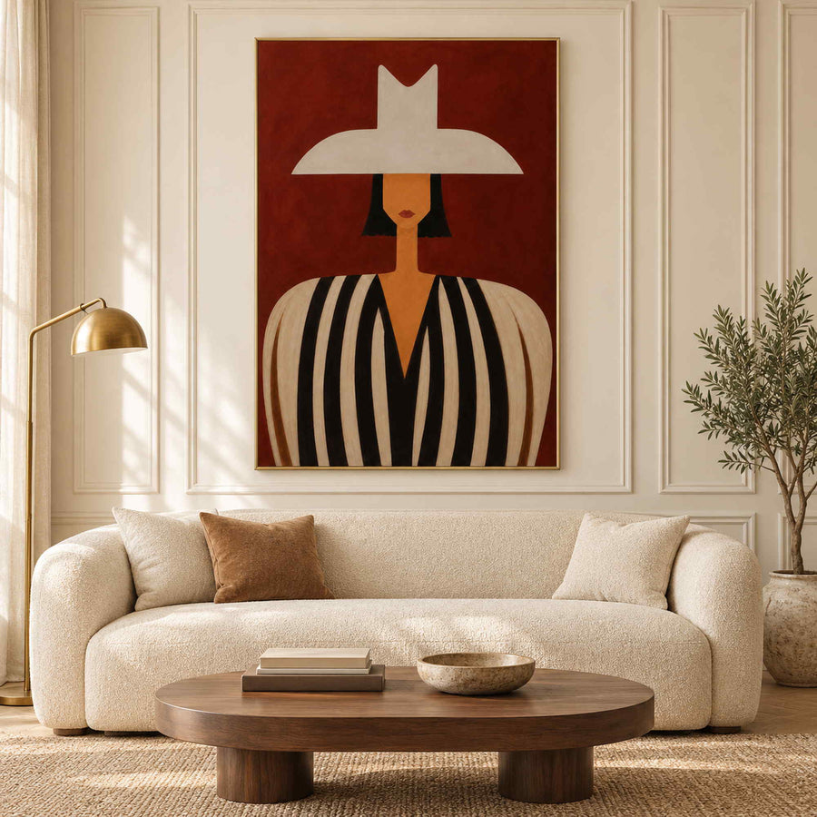Modern portrait wall art in a living room with a gold metal frame