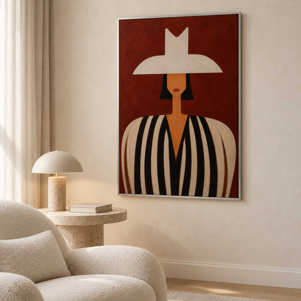 A Figure Held in Red portrait artwork in a reading corner with a silver metal frame