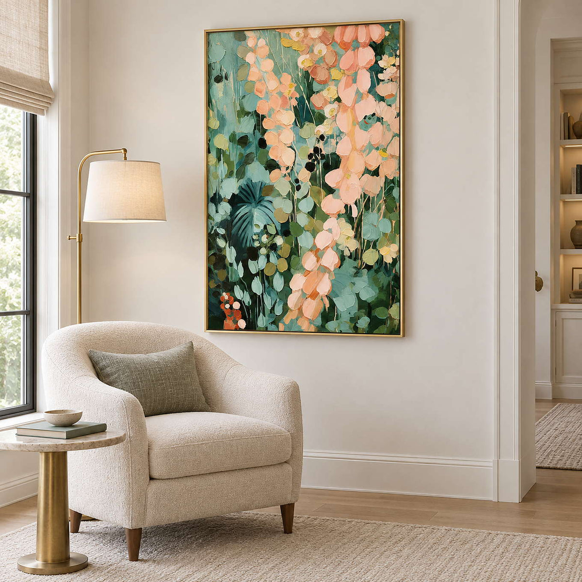 Cascading peach and blush leaves against deep green foliage in a gold frame, displayed beside seating in a lounge.