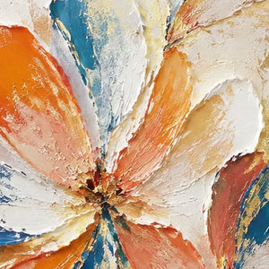 Close-up of raised hand-painted texture in warm tones, blue, and white.