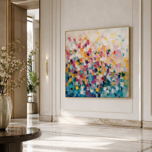 Colorful abstract wall art displayed in a hotel lobby.