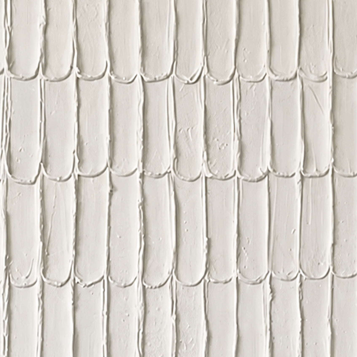 Close view of elongated cream marks with raised edges, tiny pits and soft shadows.