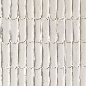 Close view of elongated cream marks with raised edges, tiny pits and soft shadows.