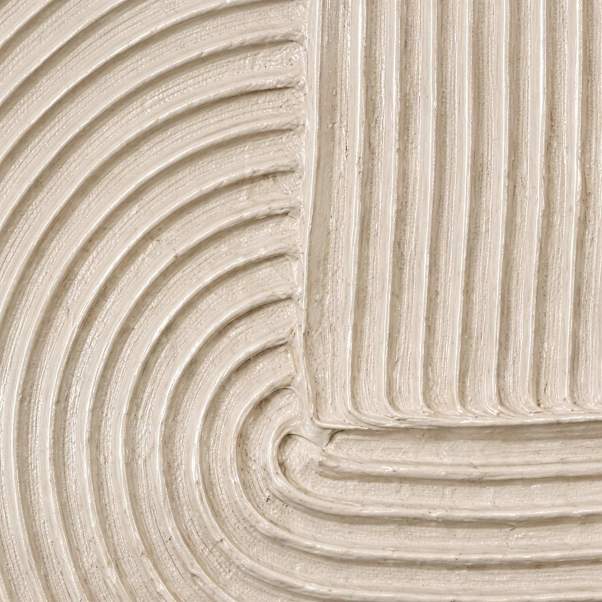 Close view of rounded beige ridges where parallel grooves turn into a curve.