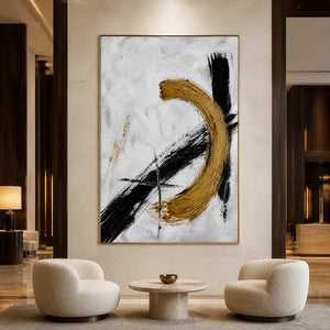 Textured black and gold wall art displayed in a luxury hotel lobby.