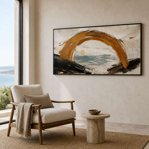 Coastal abstract wall art shown from the side in an ocean-view reading area.