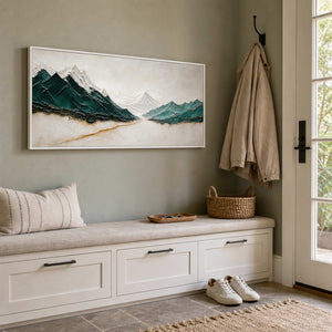 Panoramic mountain wall art displayed above a residential entryway bench.