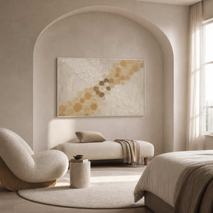 Golden circles crossing an ivory field wall art in a contemporary bedroom.
