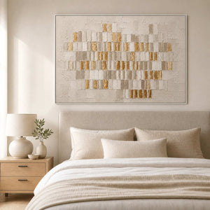 White and gold textured abstract wall art displayed in an ivory bedroom.