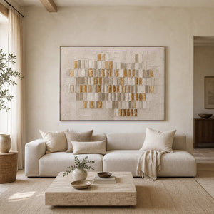 White and gold textured abstract wall art displayed in a cream living room.