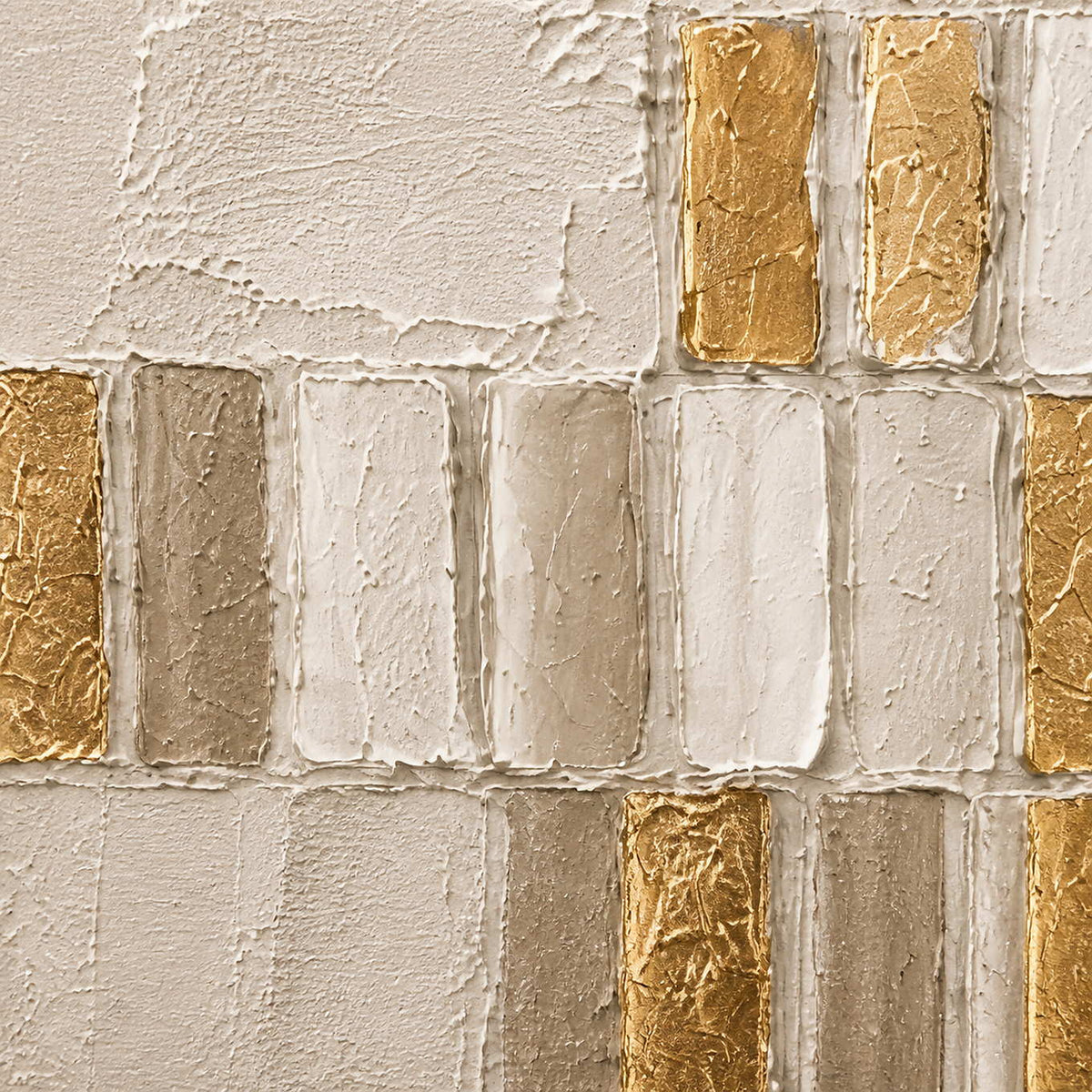 Close-up of raised cream, stone, and metallic gold geometric palette-knife texture.