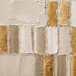 Close-up of raised cream, stone, and metallic gold geometric palette-knife texture.