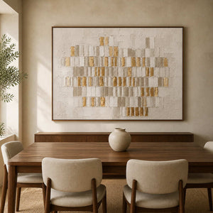 Textured white and gold abstract wall art displayed in a walnut dining room.