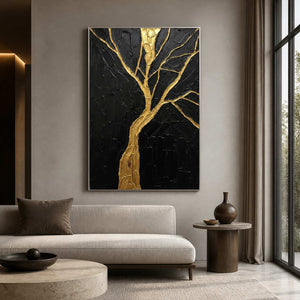 Gold tree artwork displayed above a sculptural cream living room sofa.