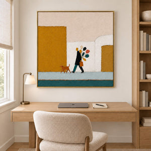 A figure walking a dog past mustard buildings with a colorful bouquet in a gold frame, displayed in a home office.