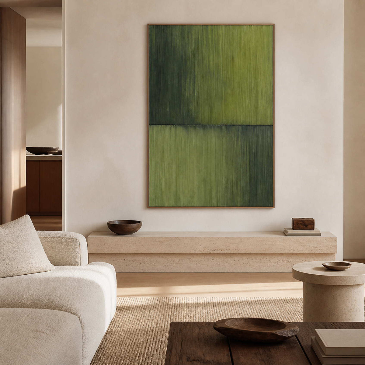 Green wabi-sabi wall art in a warm limewash living room.