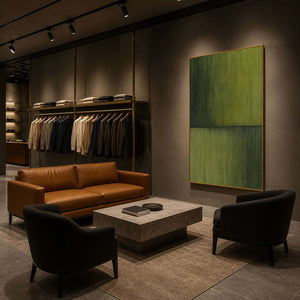 Tall olive abstract art in a boutique menswear lounge.