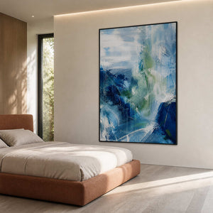Vertical blue and green textured canvas in a serene modern bedroom.